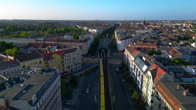 Elevated train running in prenzlauer berg. Smooth aerial view flight drone
