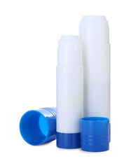 Two glue sticks with caps isolated on white