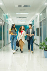 Fototapeta premium Colleagues Walking in Modern Office