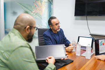 group of professionals is gathered in a modern meeting room
