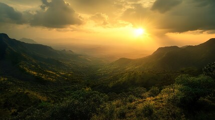A breathtaking sunrise illuminating the Girnar Hills, casting a golden glow over the rugged terrain and lush greenery.