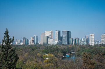 Obraz premium Mexico City city skyline and cityscape overlooking Chapultepec and Reforma with the Angel of Independence. Sunny day in Mexico City