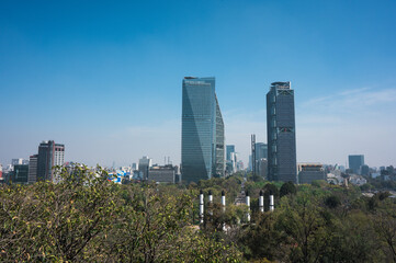 Fototapeta premium Mexico City city skyline and cityscape overlooking Chapultepec and Reforma with the Angel of Independence. Sunny day in Mexico City