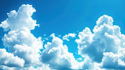Fluffy cumulus clouds drift across a vibrant blue sky.