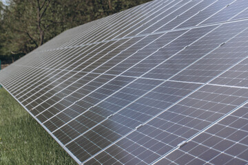 Solar panels providing sustainable energy in a green field
