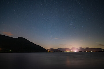 A view of Orion & a meteor over Bassenthwaite Lake in the English Lake District.