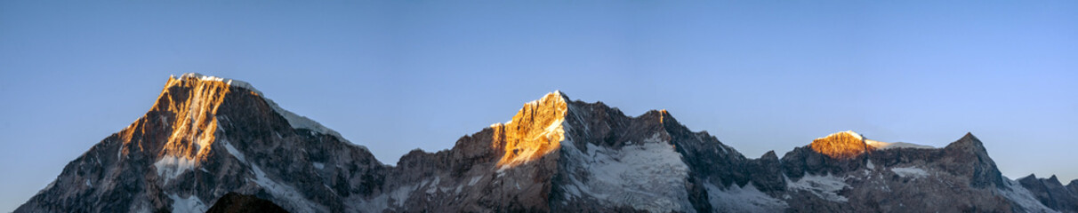 Blue, yellow, orange mountain nature landscape at sunrise. panoramic view. Background copy space