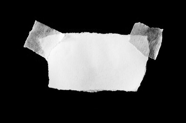 sheet of torn rip paper with masking tape on black background