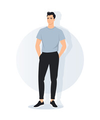 A young man in a light blue t-shirt and black pants stands in a casual pose. Laconic modern style for everyday look.