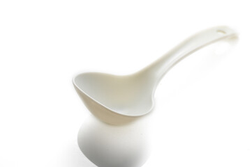 Creative kitchen utensil floats gently in soft light, enhancing culinary ambiance in a modern setting