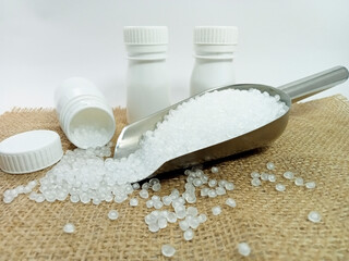 polymer, virgin polymer resin granules type grade homopolymer, isolated virgin polymer resin pellets with white background, suitable for product catalog design of plastic industry company profile