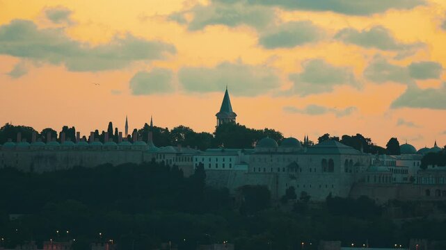 Impressive view of the historic Topkapi Palace during twilight hours. Beyazit Tower in the background, time lapse.