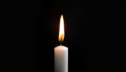 Black Background: A Single Candle Flame Casting Shadows