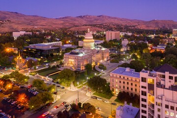 Boise, ID State Capitol at twilight. City lights illuminate the historic building and surrounding area. Evening cityscape. Idaho State Capitol, Boise, Idaho, USA.