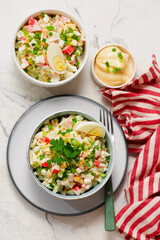 Traditional Russian salad with crab sticks, eggs and corn