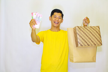 Happy Shopper with Rupiahs and Batik Bags Ready to Go After a Successful Shopping Spree
