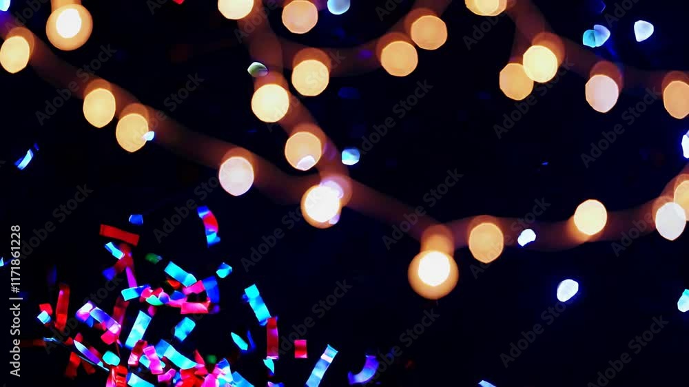 Poster strings of warm glowing lights intertwined with colorful confetti, creating a festive and celebrator