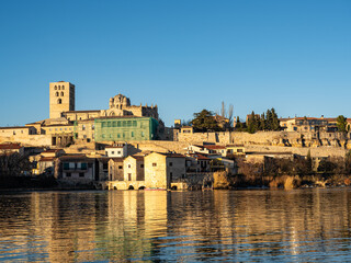 Fototapeta premium View of the Zamora cathedral, the wall and the Olivares water mills on the Duero River. Zamora. Castilla y León. Spain
