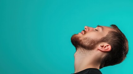 A person doing chin tuck exercises to improve neck alignment on a neutral background.