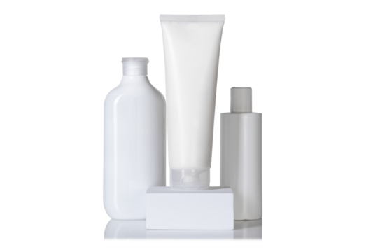 White blank tube, bottle and dispenser isolated with reflection. Beauty product mockup template. Care about hands, face, legs and body skin. Empty place for text or logo.