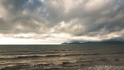 stunning warm sunset on a sea ocean sun water dramatic skies kapiti new zealand 