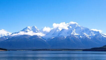 Majestic Snowcapped Mountains Rise Above Calm Lake Waters
