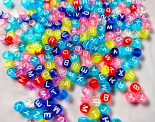 Pile of colorful beads alphabet 