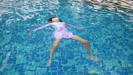 10-Year-Old Asian Girl Swimming in Free Time to Improve Skills and Survival Abilities