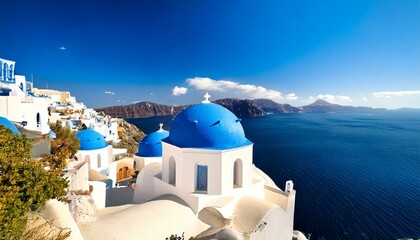 Fototapeta premium Greek church with three blue domes in the village of Oia, Santorini 