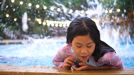 10-Year-Old Asian Girl Swimming in Free Time to Improve Skills and Survival Abilities