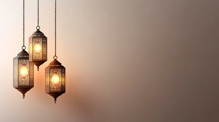 Three decorative lanterns hanging against a soft background.