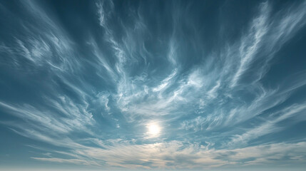 A serene sky filled with wispy clouds and sunlight, evoking tranquility and beauty.