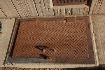 Metal Trap Door 1. An diamond plate metal trap door for underground access.