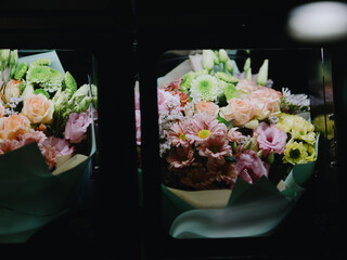 Bouquets of flowers in the cells of a flower vending machine. Self-service machine for selling gift bouquets of fresh flowers. Vending machine. Small business. December 31, 2024 - Pula, Croatia