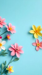 top view of colorful paper cut flowers with green leaves on blue background with copy space, wallpaper 