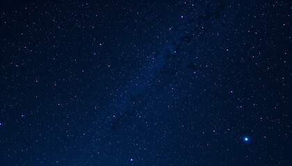 Obraz premium Starry sky background, blue night sky full of stars, glowing stars in the dark space, starry background, dark night, stars in the distance, starlight, dark background with a blue glow, night sky. 