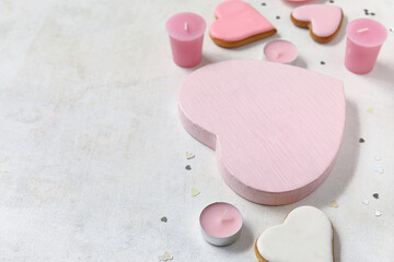 Heart shaped cookies and candles on white background. Valentine's Day celebration