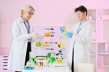 Chemists conducting experiment in laboratory