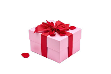 Fototapeta premium Valentine Day: Valentine Day concept: A pink gift box tied with a red bow filled with rose petals isolated on white background. 