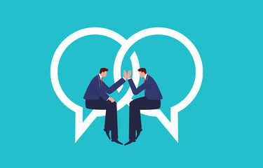 two businessmen sitting on intersecting speech bubbles giving high fives