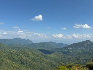 Fototapeta premium Serene Mountain Panorama Under a Blue Sky