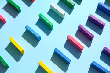 Composition with different colorful building blocks on color background