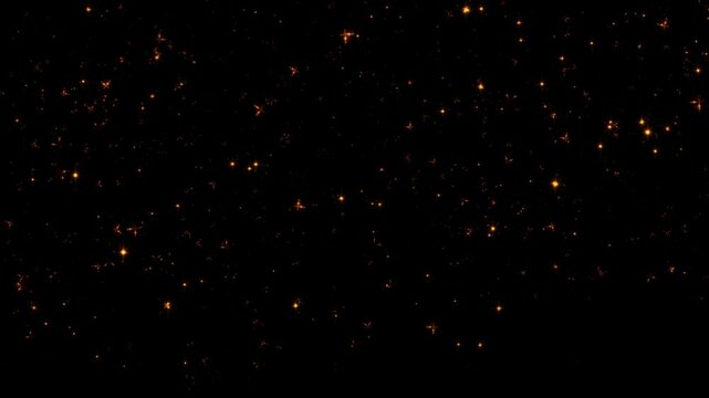 Loop animation gold dust star particles falling down on black background. 4K 3D animation of fiery glowing gold flying ember burning ash particles.