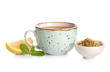 Cup of hot buckwheat tea with lemon and mint on white background