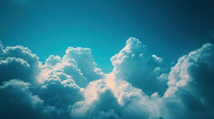 Naklejka premium Majestic Cloud formations under Bright Blue Sky Capturing the Tranquility and Serenity of Nature's Beauty in a Stunning Atmospheric Perspective