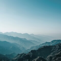 Obraz premium A majestic mountain range under a clear sky