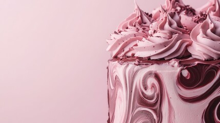 A marble effect chocolate cake with subtle rose designs and intricate piping, set against a soft pink background
