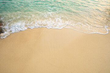 Nature of the beach and sea Summer with sunshine, sandy beaches, clear blue waters sparkling against the blue sky. On an island with good ecology and environment Background for summer vacation