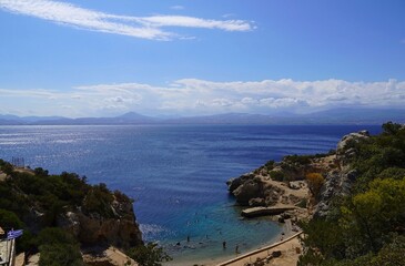 Fototapeta premium View of the Heraion archaeological site with people swimming in its harbor