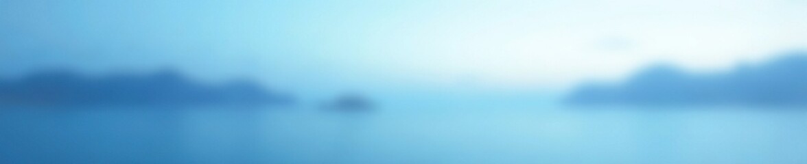 Softly fading blue and white gradient with a gentle glow, calm atmosphere, soft focus, serene landscape